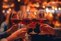 Hands holding glasses of wine on restaurant background.Generative AI