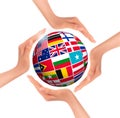 Hands holding globe with flags of world Royalty Free Stock Photo