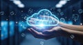 Hands holding a glowing digital cloud with data icons representing cloud computing and technology Royalty Free Stock Photo
