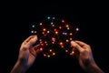 Hands Holding a Glowing Network of Connections