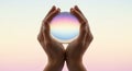 Hands Holding Glowing Pastel Orb with Ethereal Gradient Light Royalty Free Stock Photo