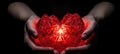 Hands holding glowing red heart, concept of love and St Valintine Day gifts and celebration Royalty Free Stock Photo