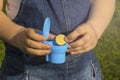 Hands holding a gold coin. Money in the toilet. money in a toilet bowl Royalty Free Stock Photo