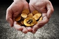 Hands holding golden bitcoin coins Royalty Free Stock Photo