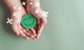 Hands holding green happy smile face, good feedback rating, positive customer review, experience, satisfaction survey, smiley