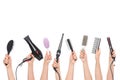 Hands holding hairdressing tools
