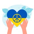 Hands holding heart in national colors of Ukrainian flag and peace hippy symbol inside