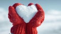 The hands holding a heart-shaped snow sculpture in winter. AI generated image Royalty Free Stock Photo