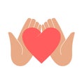 Hands holding a heart, symbol of peace, help, cooperation or charity and volunteering Royalty Free Stock Photo