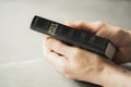 Hands holding Holy Bible over grey background. Sharing the Gospel with youth. Copy space. Christian concept Royalty Free Stock Photo