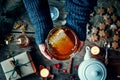 Girl`s hands holding honey jar in Christmas theme