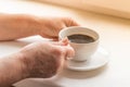 Woman hands holding a hot coffee Royalty Free Stock Photo