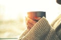 Hands holding hot cup of coffee or tea Royalty Free Stock Photo