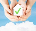 Hands holding house with check mark Royalty Free Stock Photo