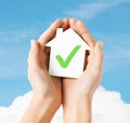 Hands holding house with check mark Royalty Free Stock Photo