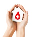 Hands holding house with donor sign Royalty Free Stock Photo