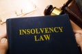 Hands holding insolvency law.