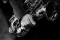 Saxophone player hands on the stage black and white Royalty Free Stock Photo