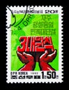 Hands holding Korean characters, 20th anniversary of the start o