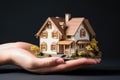 hands holding little house Royalty Free Stock Photo