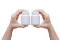 Hands holding medicine bottles on white Royalty Free Stock Photo