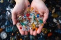 Hands holding microplastics picked up on a beach. Water pollution, ecology, environmental pollution Royalty Free Stock Photo