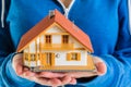 Hands holding miniature house model Royalty Free Stock Photo