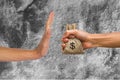 A hands holding money bag and rejecting hand to receive money of Royalty Free Stock Photo
