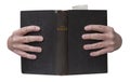 Hands holding the muslim Koran holy book of Islam open