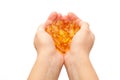 Hands holding omega-3 fish fat oil