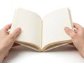 Hands holding open book, isolated on white background Royalty Free Stock Photo