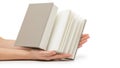 Hands holding open book pages, isolated on white background Royalty Free Stock Photo