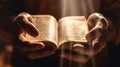 Hands holding open christian bible Royalty Free Stock Photo