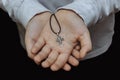 Hands holding an Orthodox cross close-up Royalty Free Stock Photo