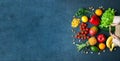 Hands holding a paper bag with vegetarian food Royalty Free Stock Photo