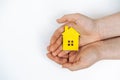 hands holding paper house, family home, homeless housing, mortgage crisis and home protecting insurance concept, foster