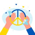 Hands holding peace hippy symbol and summer flowers, person giving help to Ukrainians