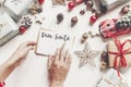 hands holding pencil and writing a letter wish list to santa claus flat lay with space for text. merry christmas and happy new ye Royalty Free Stock Photo