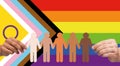 hands holding people pictogram over pride flag Royalty Free Stock Photo