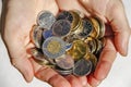 Hands holding Canadian Cash Coins