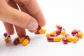 Hands holding pills on white Royalty Free Stock Photo