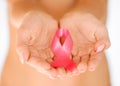 Hands holding pink breast cancer awareness ribbon Royalty Free Stock Photo