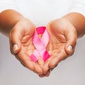 Hands holding pink breast cancer awareness ribbon Royalty Free Stock Photo