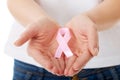 Hands holding pink breast cancer awareness ribbon Royalty Free Stock Photo