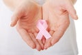 Hands holding pink breast cancer awareness ribbon Royalty Free Stock Photo