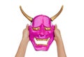 Hands holding pink Kabuki Mask on white background Royalty Free Stock Photo