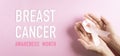Hands holding pink ribbon, Breast cancer awareness, symbolic bow color raising awareness on women`s breast tumor. Healthcare, Royalty Free Stock Photo