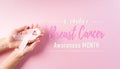 Hands holding pink ribbons, Breast cancer awareness, symbolic bow color raising awareness on women`s breast tumor. Healthcare and Royalty Free Stock Photo