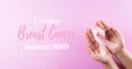 Hands holding pink ribbons, Breast cancer awareness, symbolic bow color raising awareness on women`s breast tumor. Healthcare, Royalty Free Stock Photo