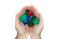 Hands holding plastic bottles caps for recycling, Royalty Free Stock Photo